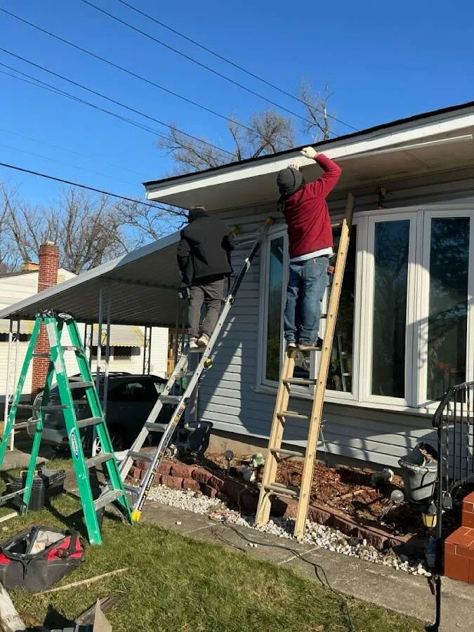 Restoration crew performing exterior repair in Tewksbury